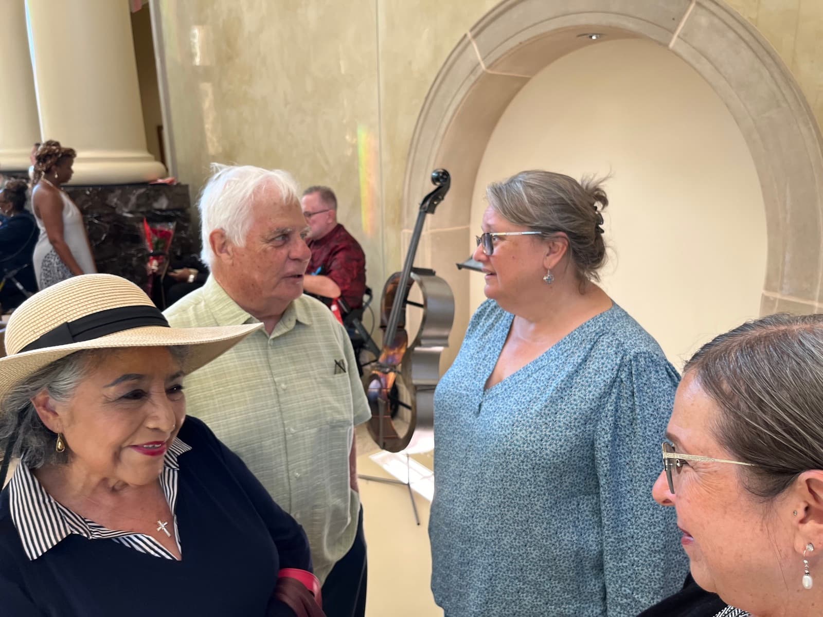 Robin Cole speaking with community members at a local gathering